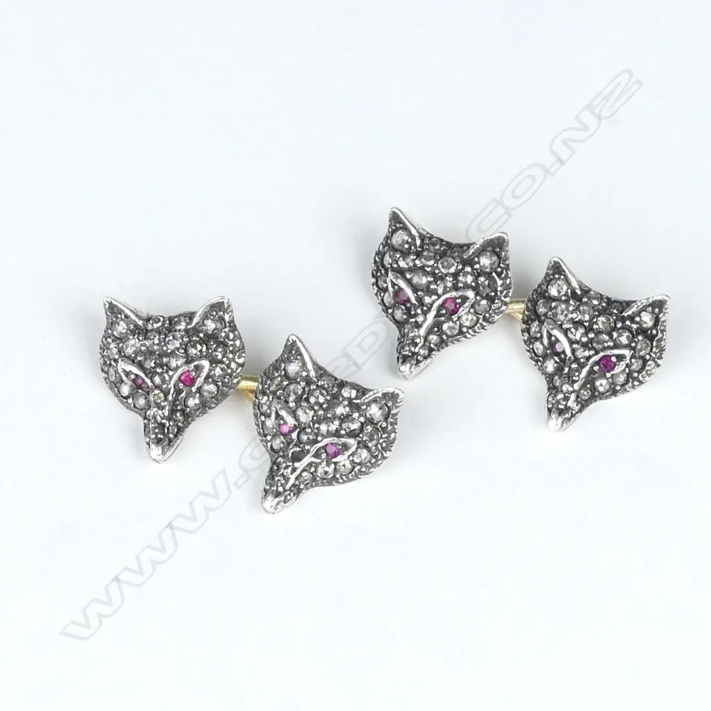 A pair of Edwardian gold silver and diamond set foxes’ head cufflinks Image 1++
