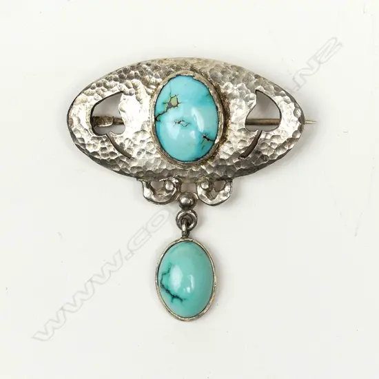 A rare N.Z. Reuben Watts (1869-1940) silver and turquoise brooch