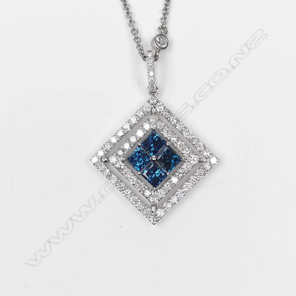 A 14ct white gold diamond pendant Image 1++