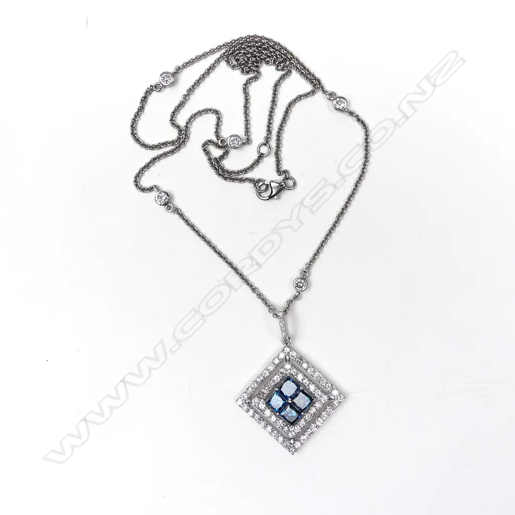 A 14ct white gold diamond pendant Image 1++