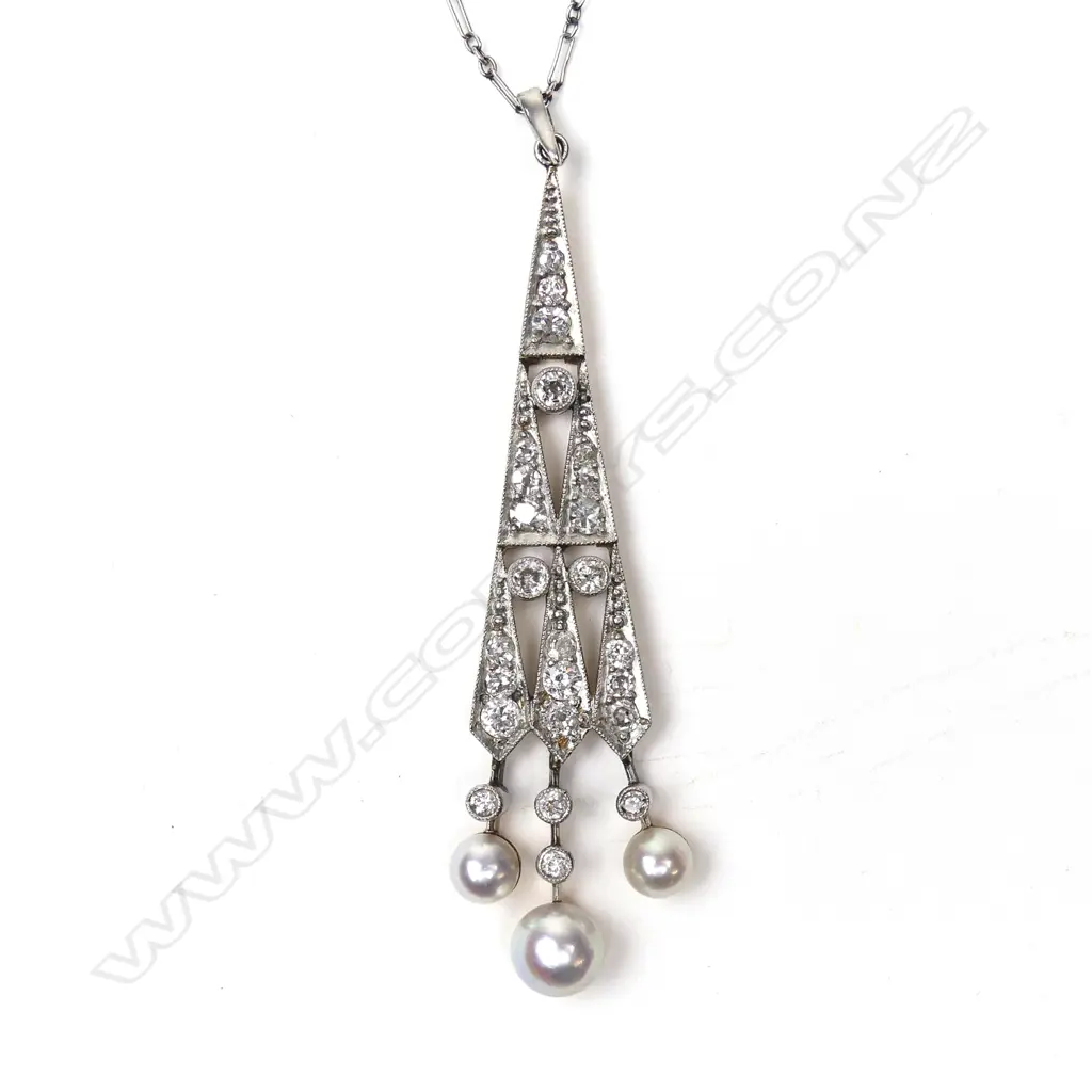 A good Art Deco 15ct. yellow gold platinum diamond and pearl pendant on chain Image 1++