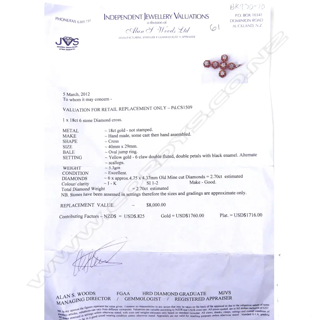 An 18ct gold and diamond set cross Image 1++