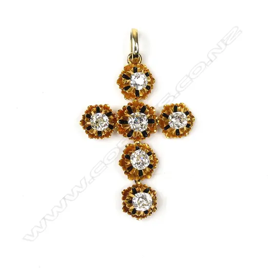 An 18ct gold and diamond set cross
