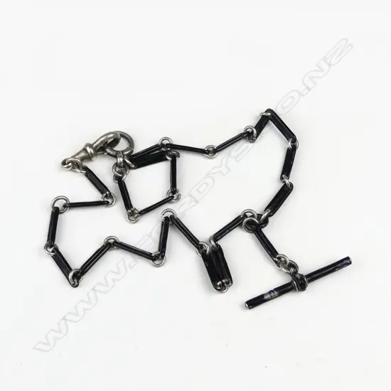 A vintage silver and black enamel fob chain