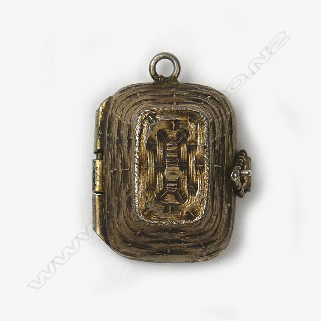 A small Egyptian silver gilt pendant in the form of a Moses basket Image 1++