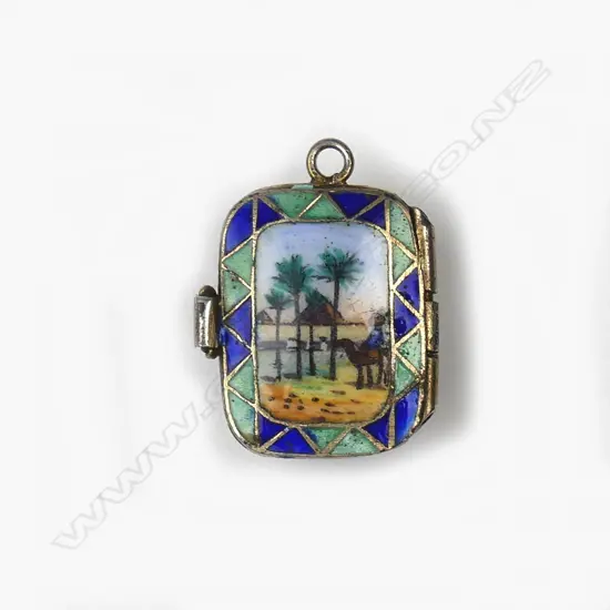 A small Egyptian silver gilt pendant in the form of a Moses basket