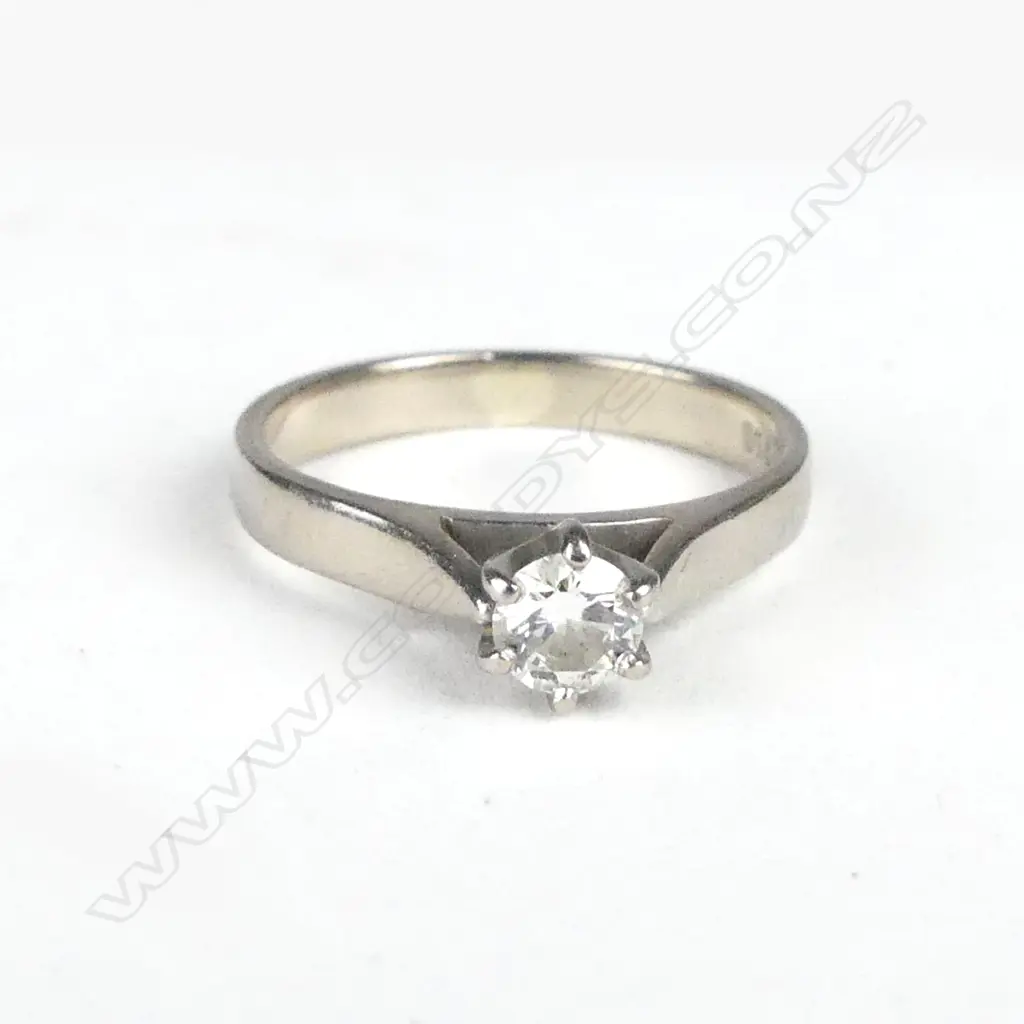An 18ct white gold and diamond solitaire ring Image 1++