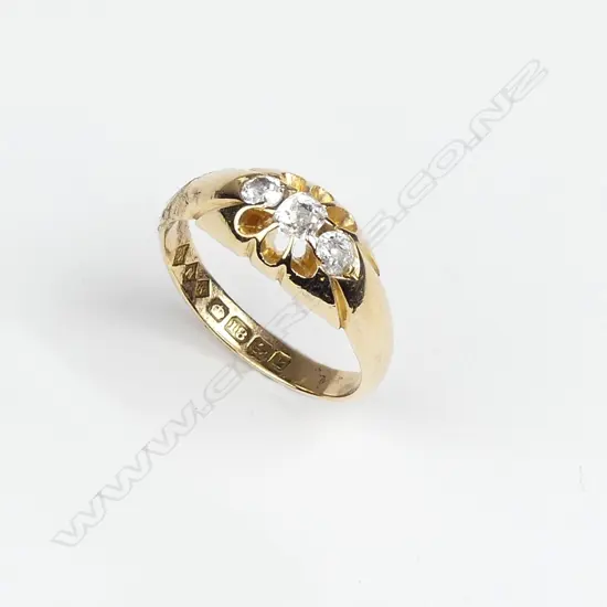 An Edwardian 18ct. yellow gold three stone diamond ring