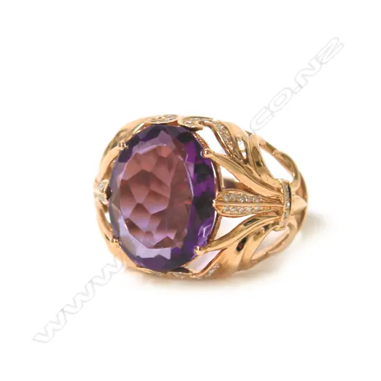 An 18ct. rose gold modern large amethyst and diamond dress ring