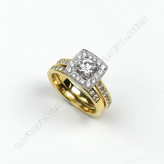 An 18ct yellow and white gold diamond ring set