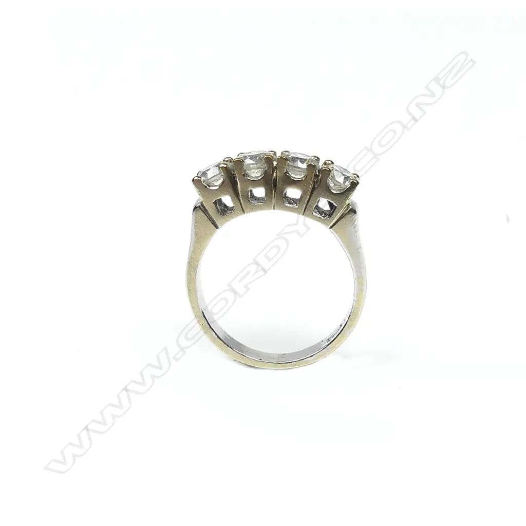 An 18ct white and yellow gold four stone diamond ring Image 1++