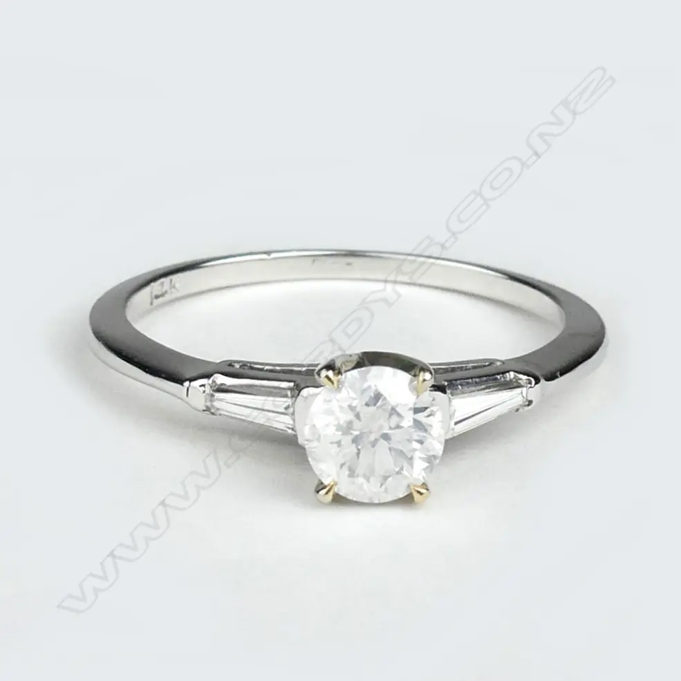 A 14ct white and yellow gold diamond solitaire ring Image 1++