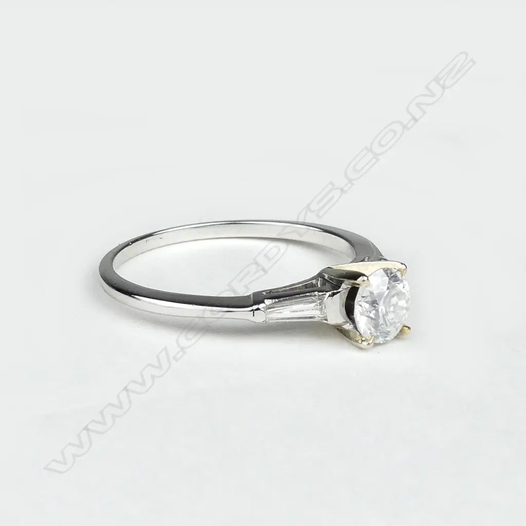 A 14ct white and yellow gold diamond solitaire ring Image 1++