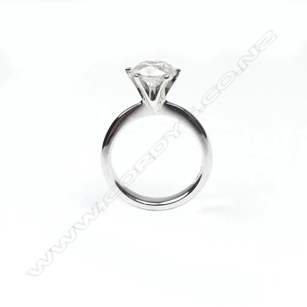 A 14ct white and yellow gold diamond solitaire ring Image 1++