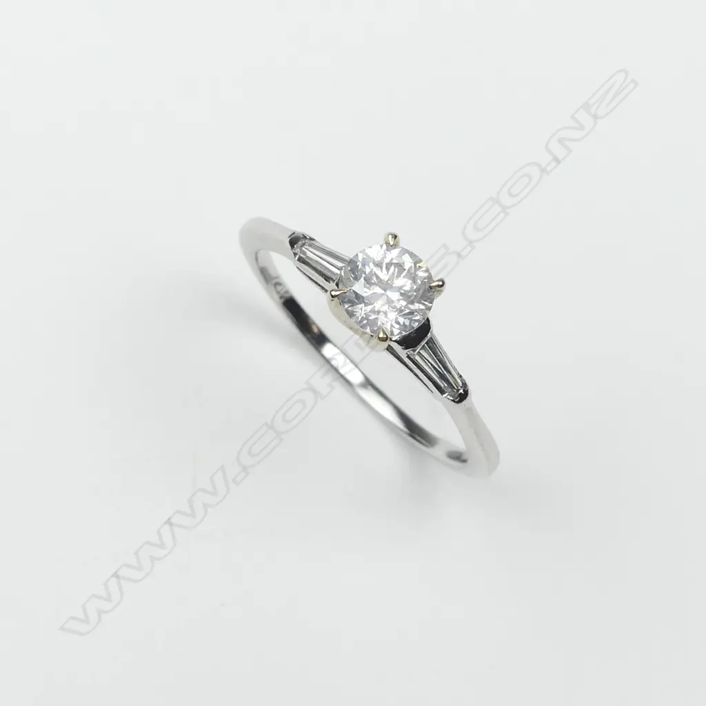 A 14ct white and yellow gold diamond solitaire ring Image 1++