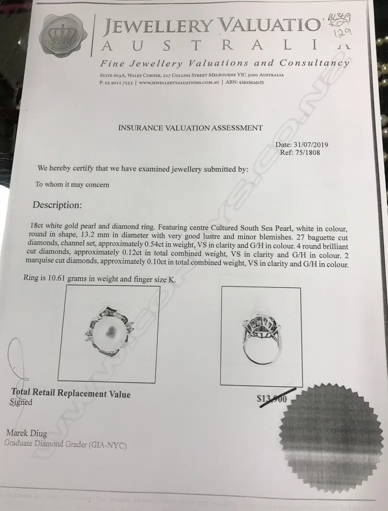 An 18ct white gold pearl and diamond ring Image 1++