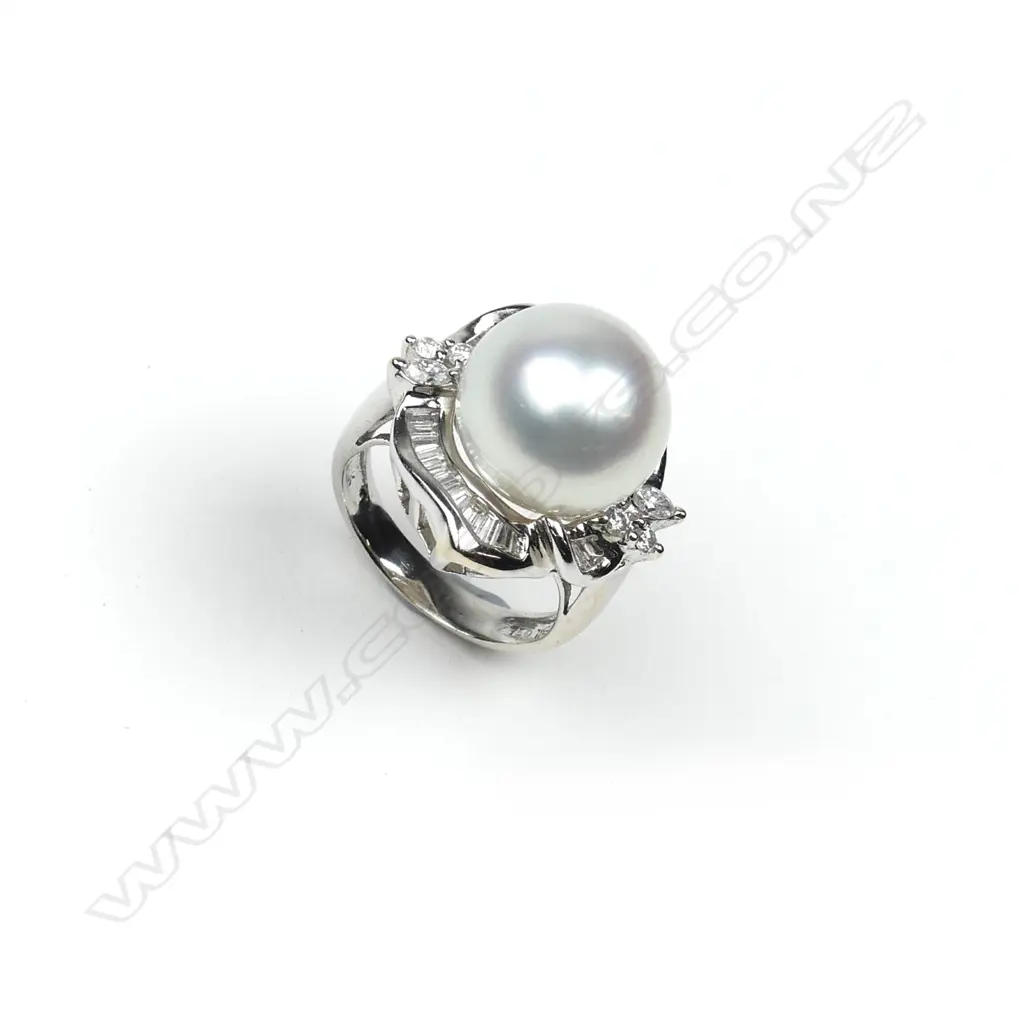 An 18ct white gold pearl and diamond ring Image 1++