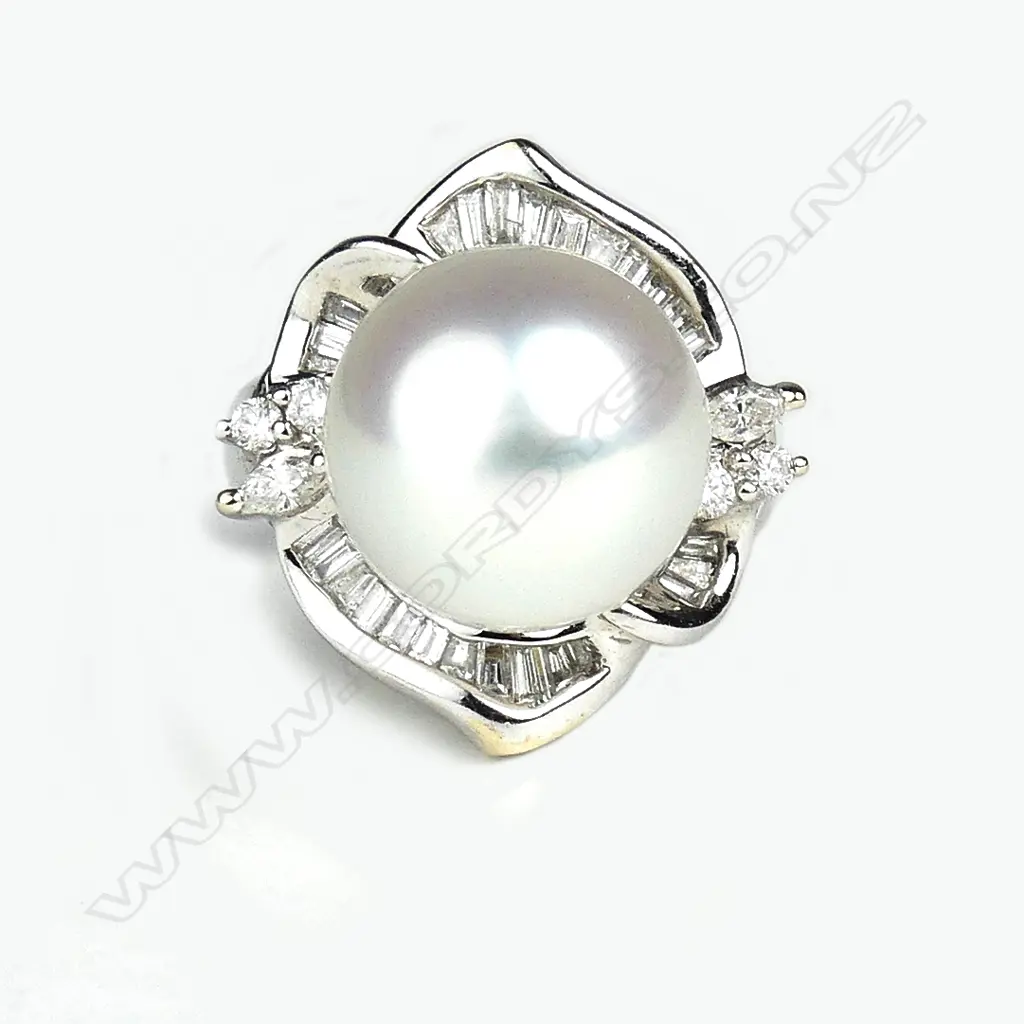 An 18ct white gold pearl and diamond ring Image 1++
