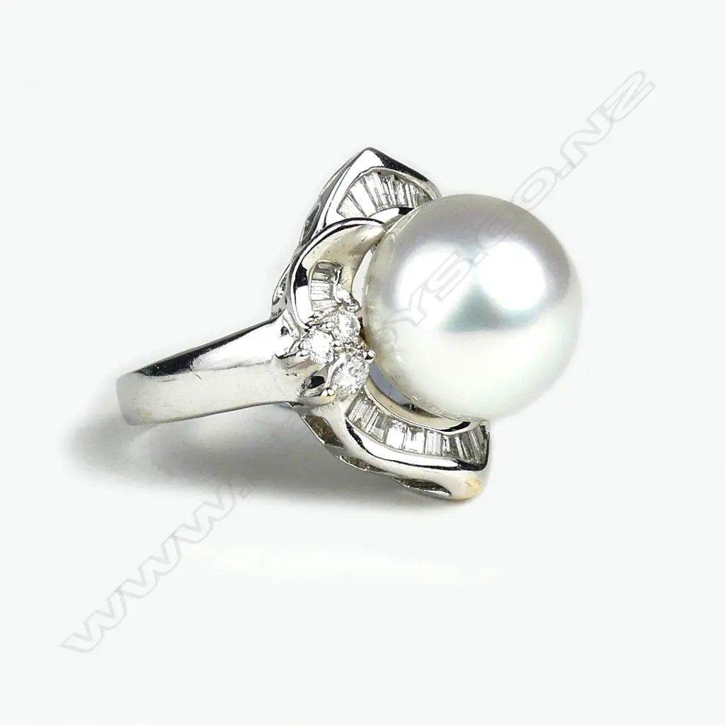 An 18ct white gold pearl and diamond ring Image 1++