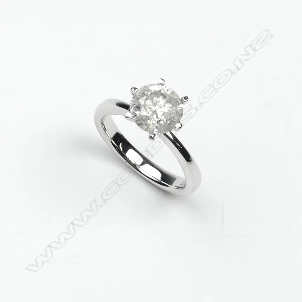 An 18ct white gold and diamond solitaire ring Image 1++
