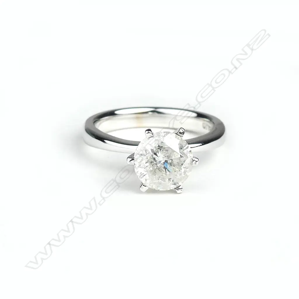 An 18ct white gold and diamond solitaire ring Image 1++