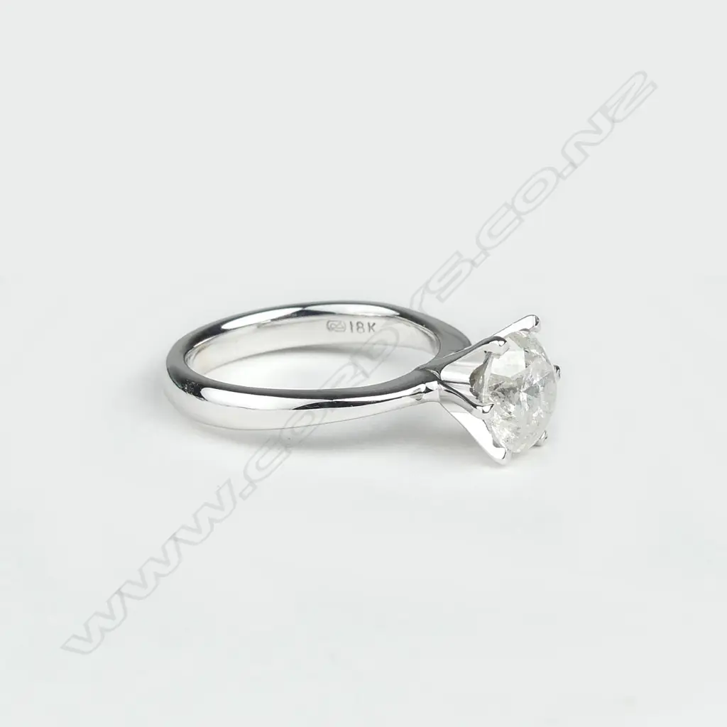 An 18ct white gold and diamond solitaire ring Image 1++