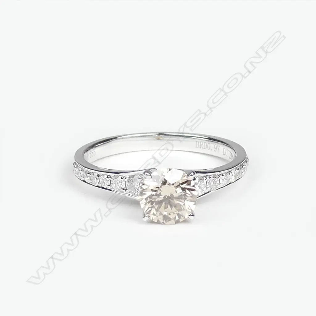 A 14ct white gold and diamond ring Image 1++