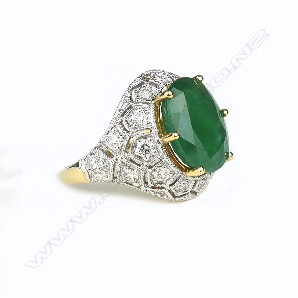An 18ct yellow and white gold emerald and diamond ring Image 1++