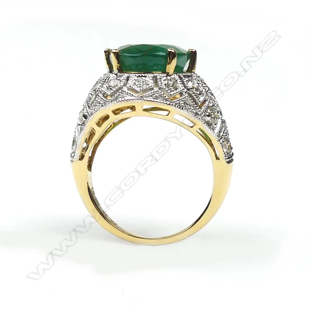 An 18ct yellow and white gold emerald and diamond ring Image 1++