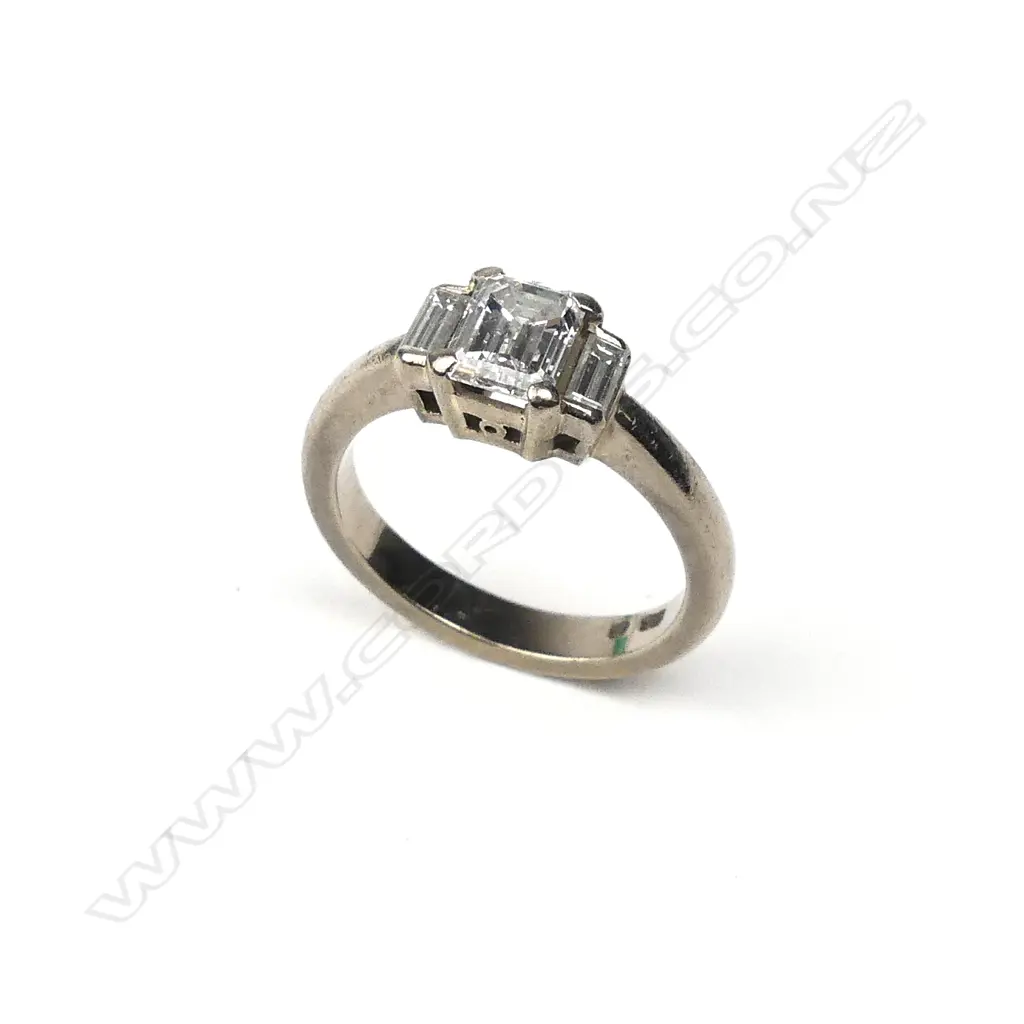 An 18ct white gold and three stone diamond ring Image 1++