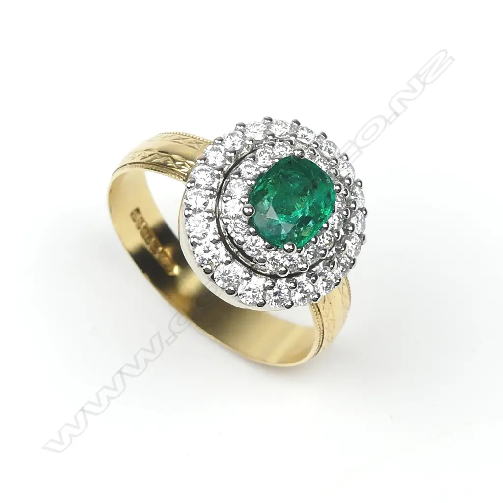An 18ct yellow and white gold emerald and diamond ring Image 1++