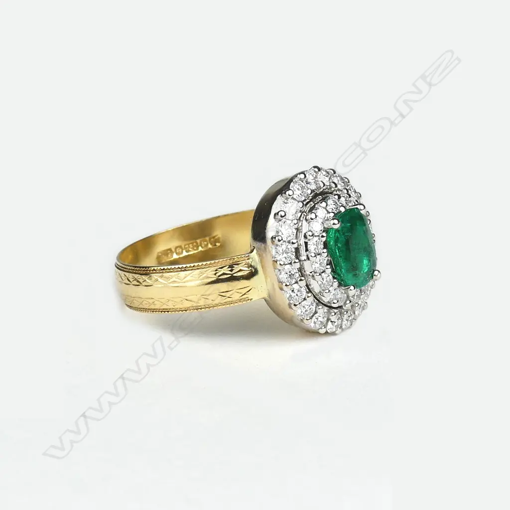 An 18ct yellow and white gold emerald and diamond ring Image 1++