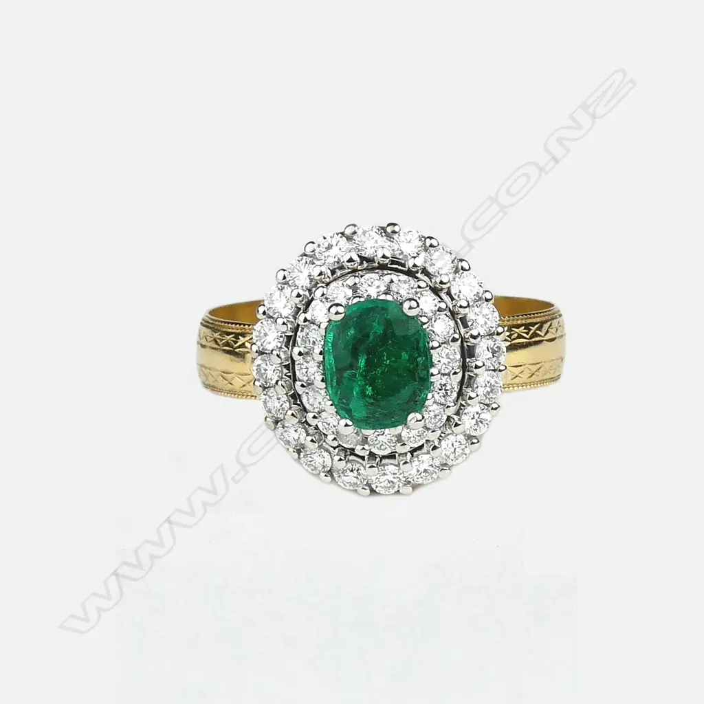 An 18ct yellow and white gold emerald and diamond ring Image 1++