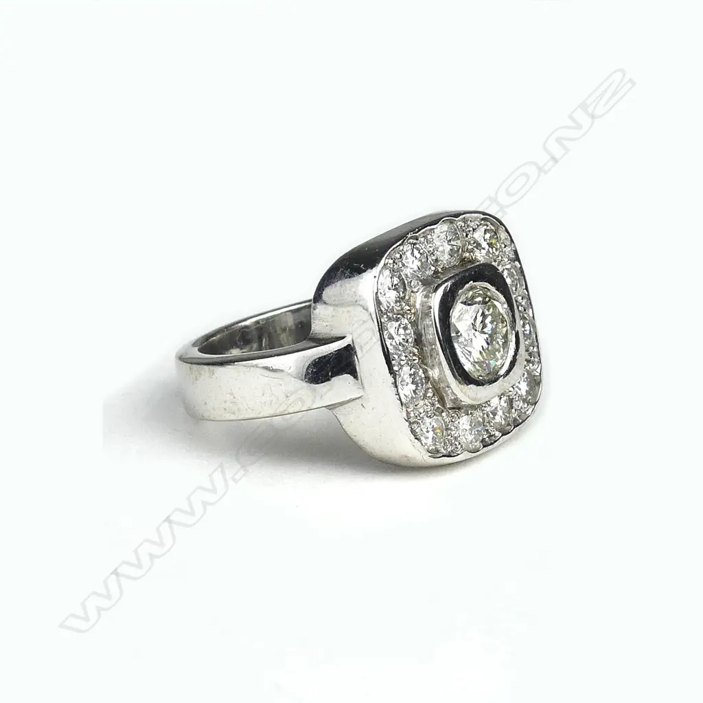 A 15ct white gold and diamond cluster ring Image 1++