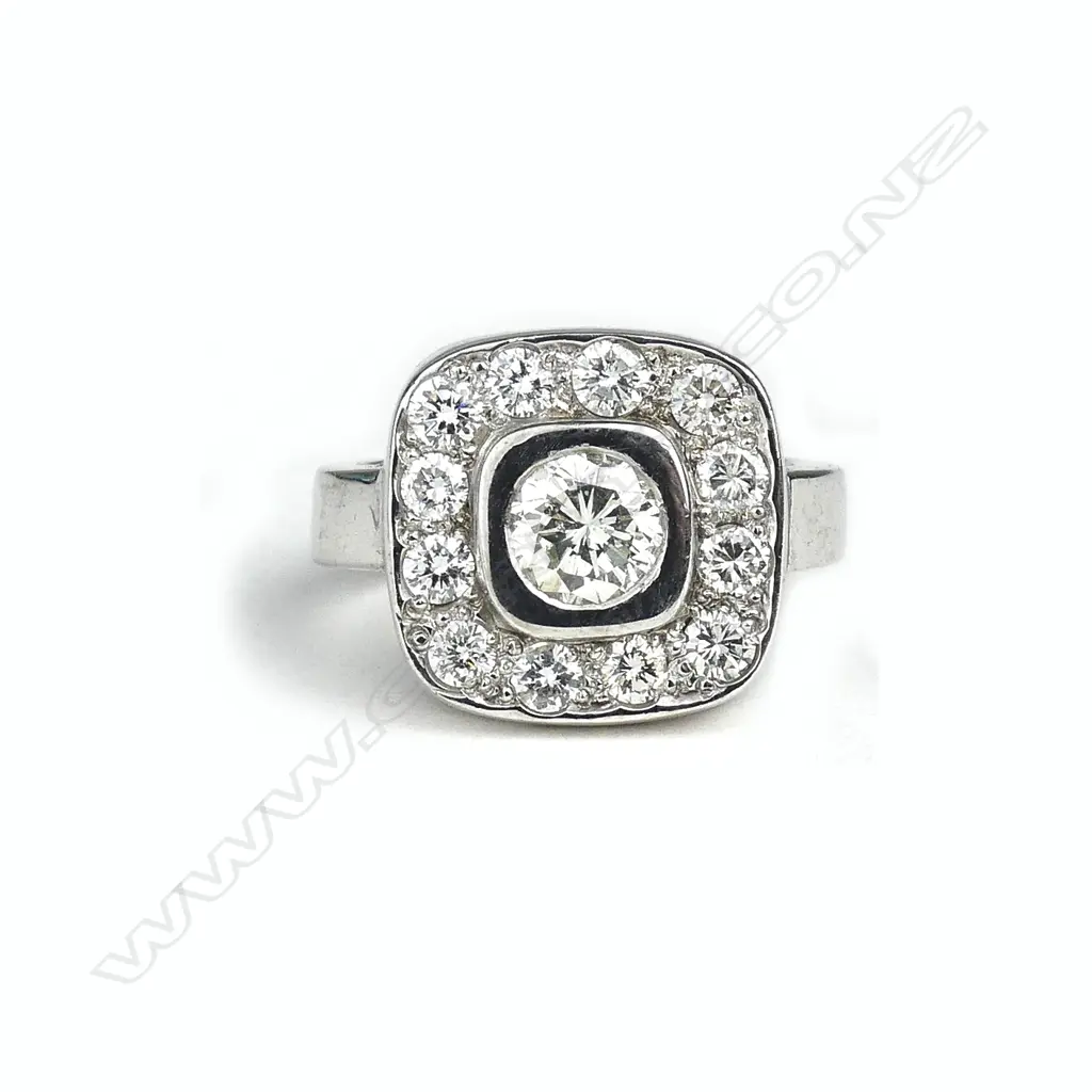 A 15ct white gold and diamond cluster ring Image 1++