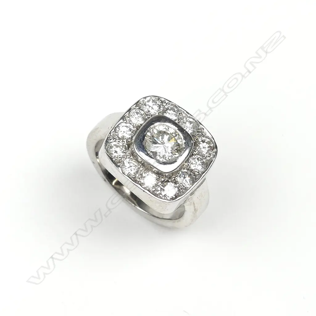 A 15ct white gold and diamond cluster ring Image 1++
