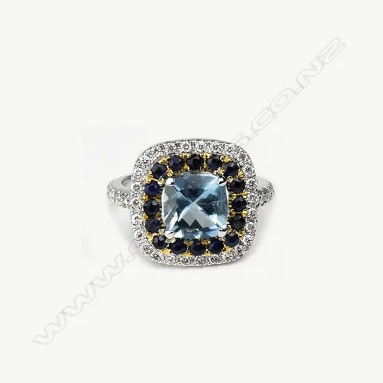 An 18ct white gold aquamarine diamond and sapphire ring