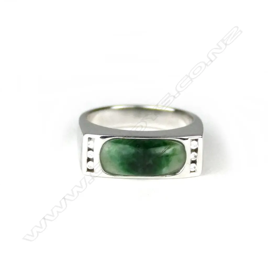An 18ct. white gold jade and diamond modern dress ring Image 1++