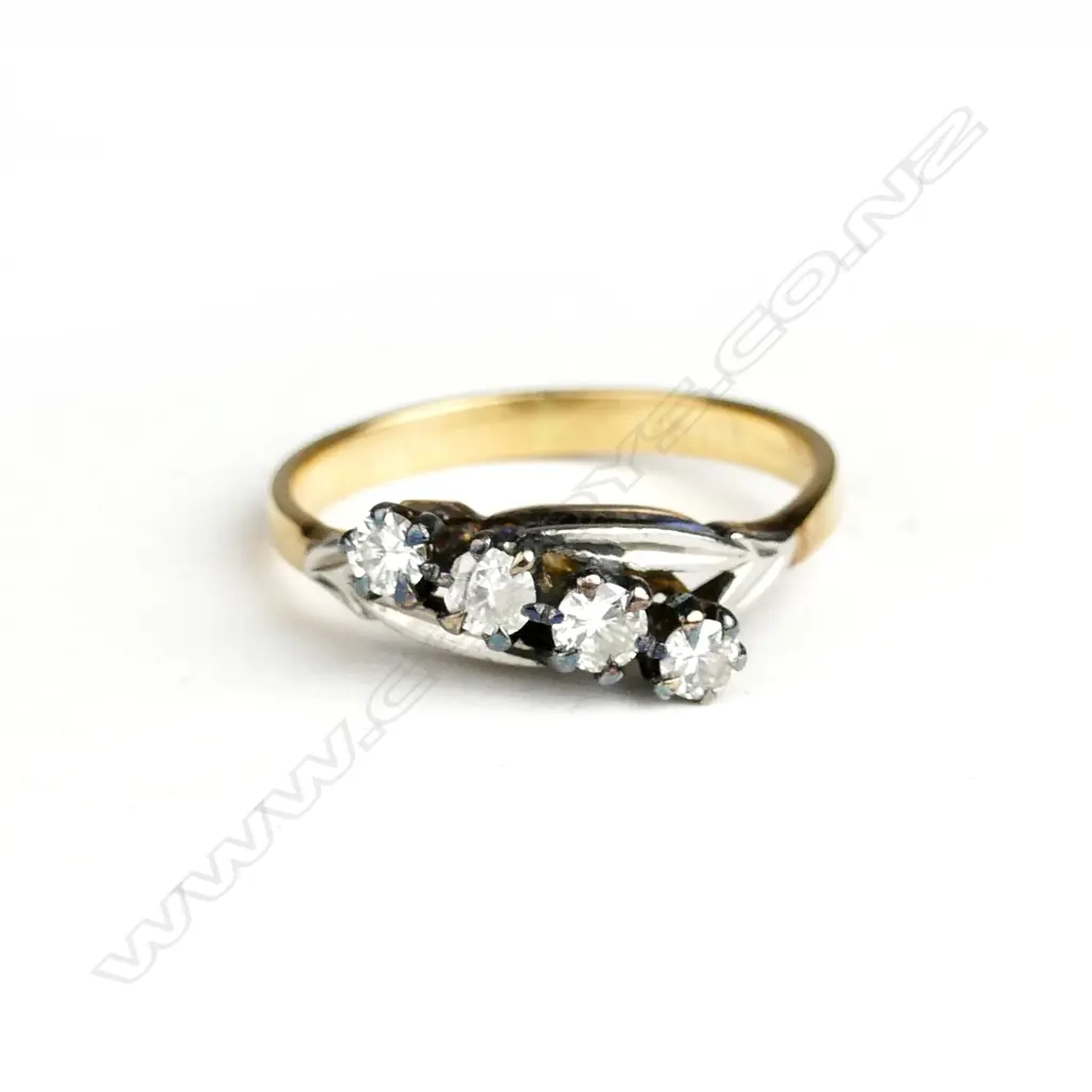 An estate 18ct. yellow and white gold four diamond ring Image 1++