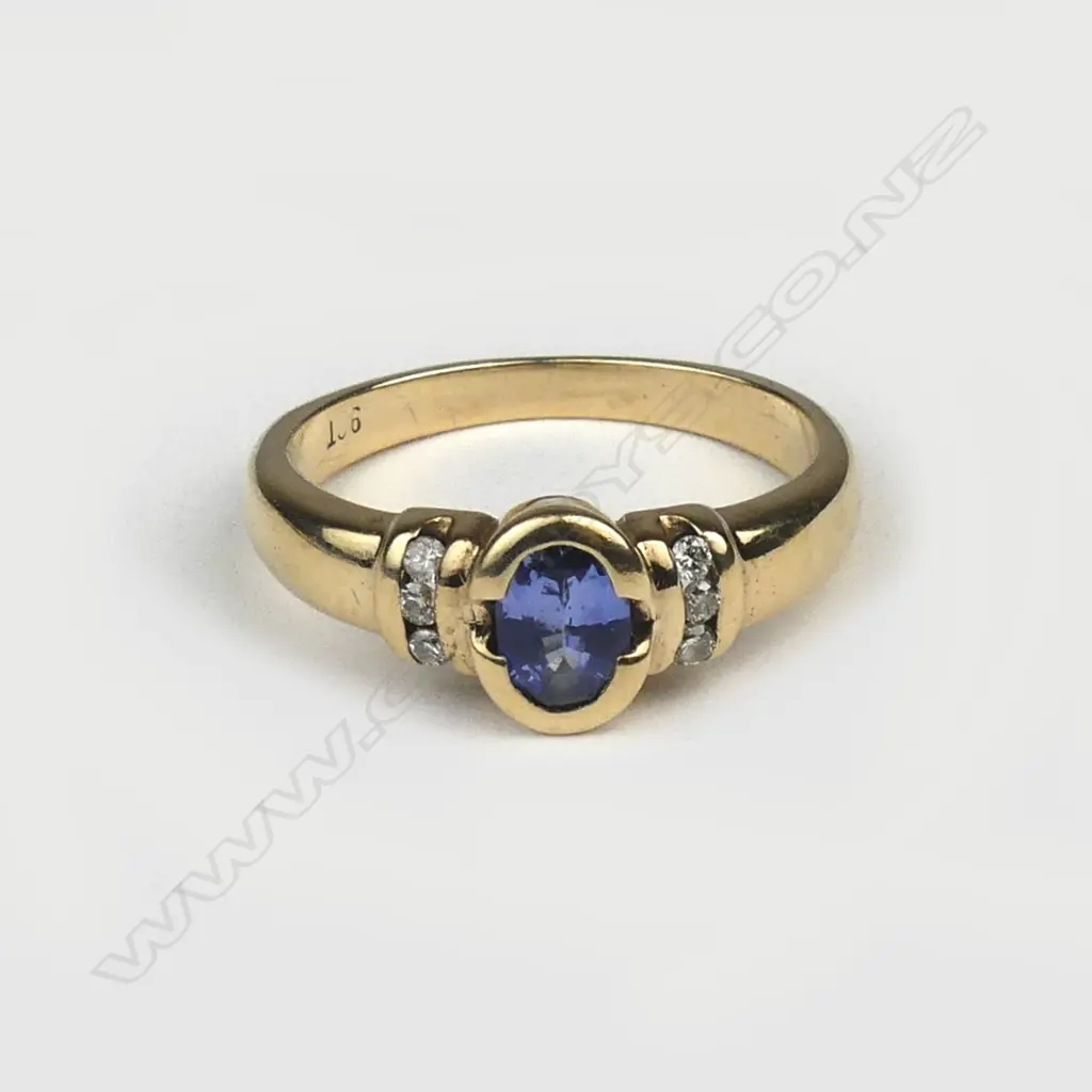 A 9ct. yellow gold sapphire and diamond ring Image 1++