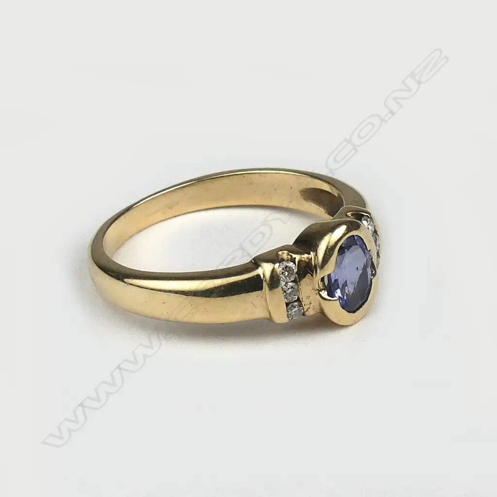 A 9ct. yellow gold sapphire and diamond ring Image 1++