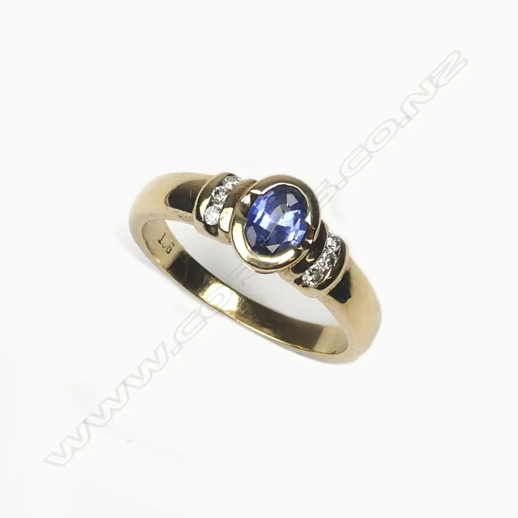 A 9ct. yellow gold sapphire and diamond ring Image 1++