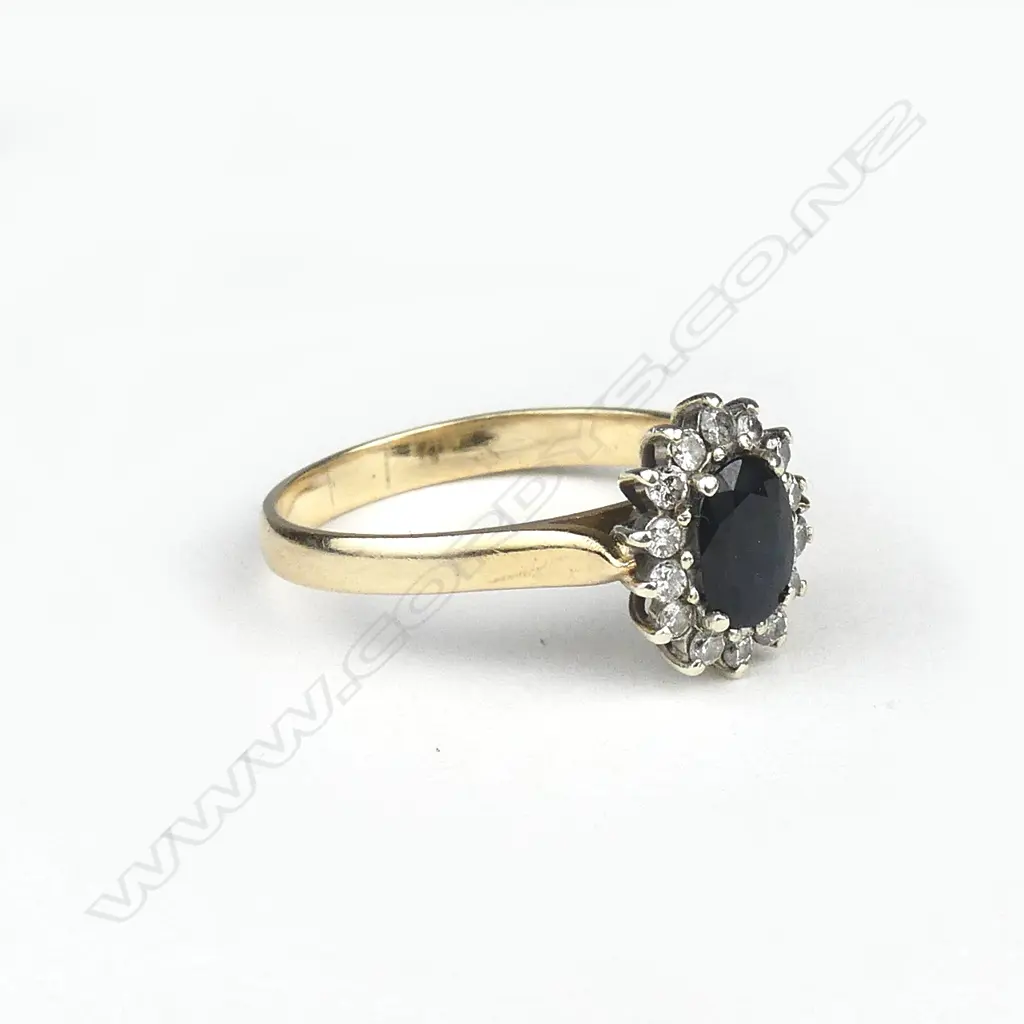 A 9ct gold sapphire and diamond cluster ring Image 1++