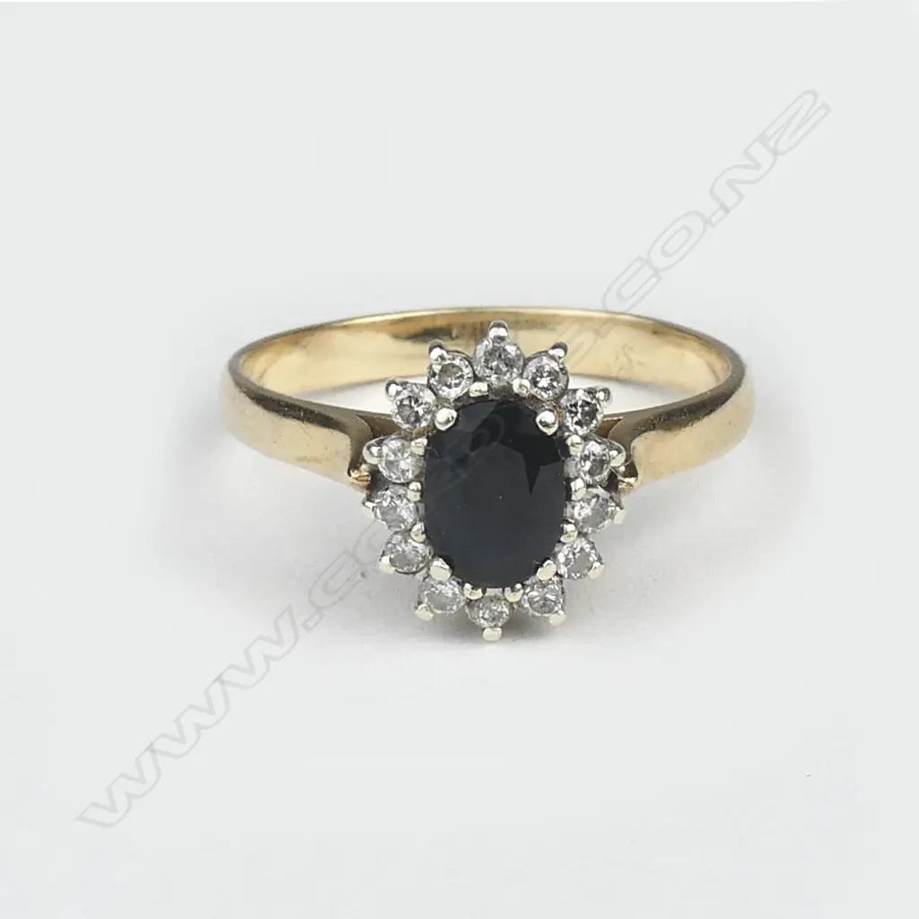 A 9ct gold sapphire and diamond cluster ring Image 1++