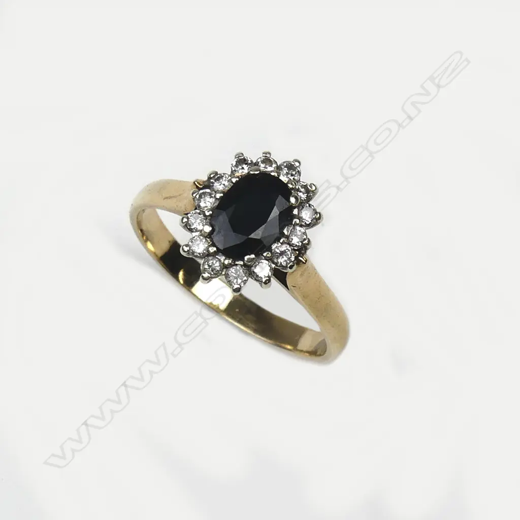 A 9ct gold sapphire and diamond cluster ring Image 1++