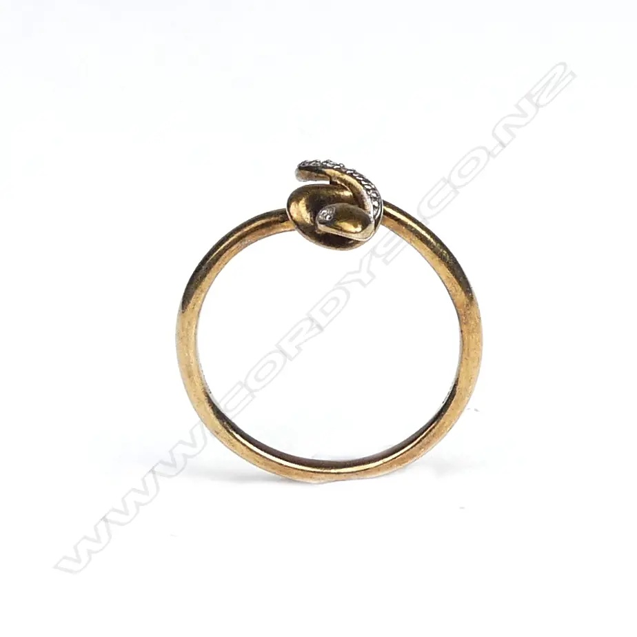 A vintage 9ct. yellow gold and diamond set snake ring Image 1++