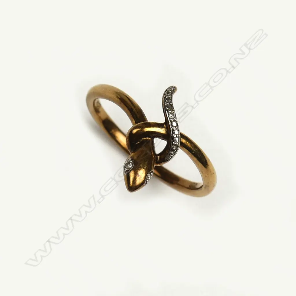 A vintage 9ct. yellow gold and diamond set snake ring Image 1++