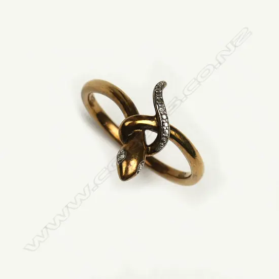 A vintage 9ct. yellow gold and diamond set snake ring