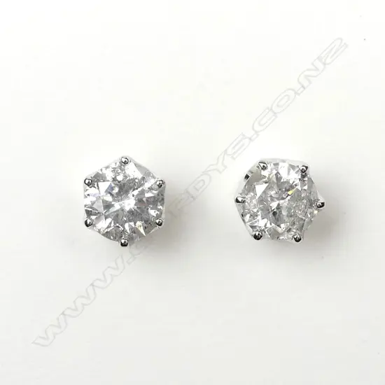 A pair of 14ct white gold and diamond stud earrings