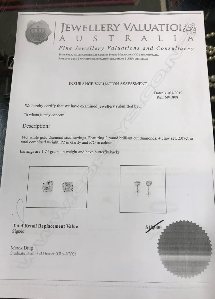 A pair of 14ct white gold and diamond stud earrings Image 1++